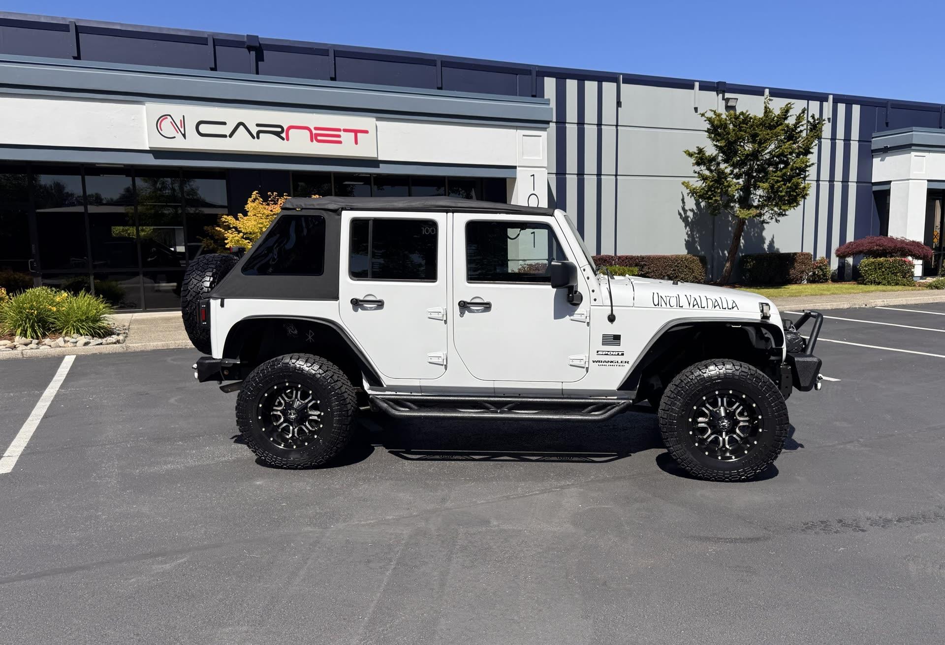 Jeep Wrangler Unlimited Sport — vehicle photo 2