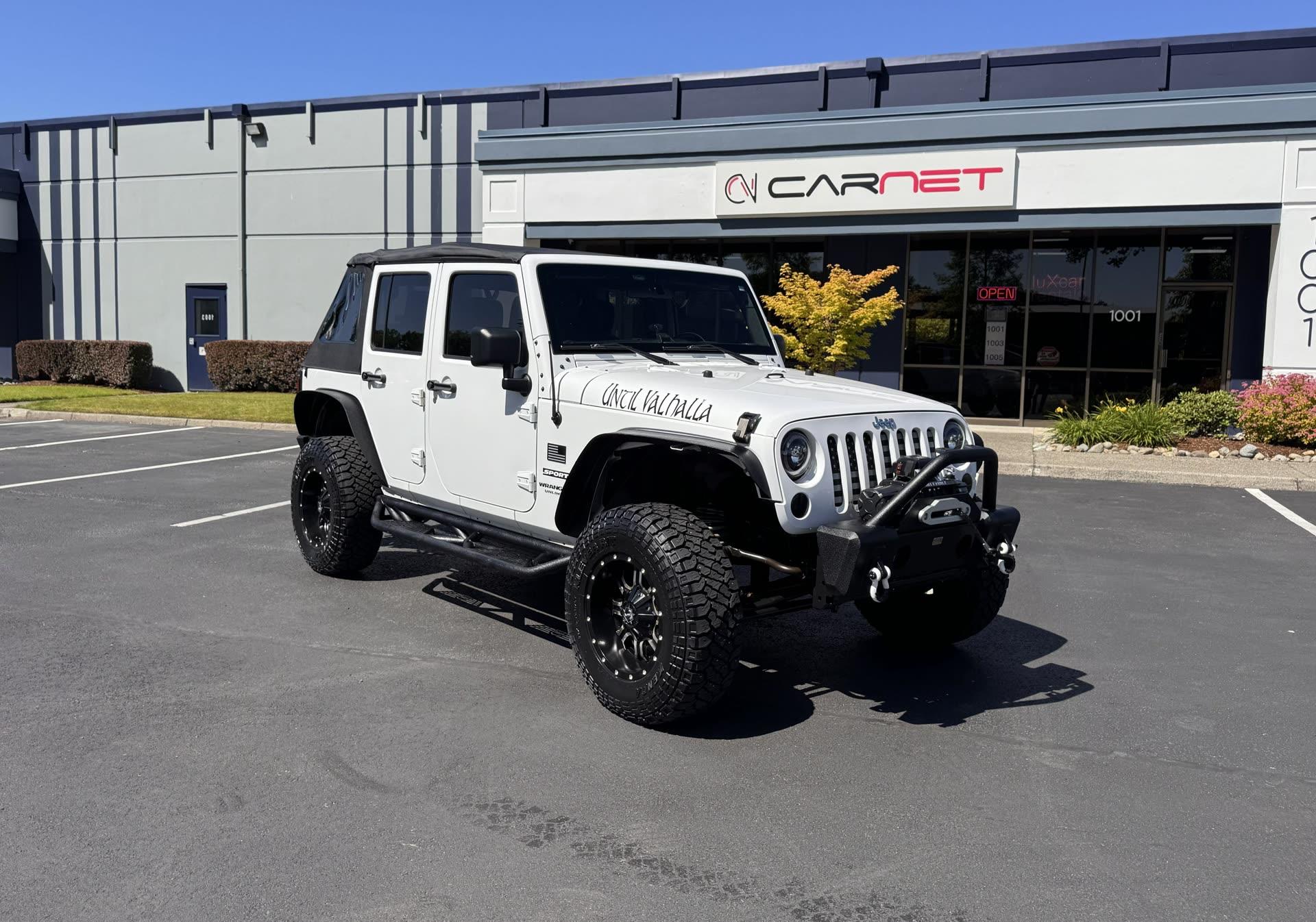 Jeep Wrangler Unlimited Sport — vehicle photo 1